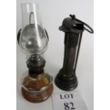An original Miner's lamp and a scholar's oil lamp with mirror back to reflect the flame, 29cm tall.