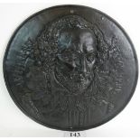 A large cast iron wall plaque, cast in relief with William Shakespeare, 55cm diameter.