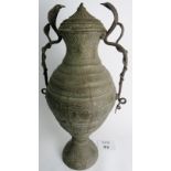 A large Indian brass twin handled jar with lid, two cobra handles,
