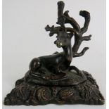 A bronze stag paperweight.