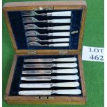 A mother of pearl silver plated set of six knives and forks, 183mm long.