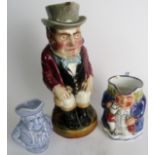 Three Toby jugs, one large Victorian of a gentleman holding bags of coins, and two later,
