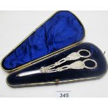 A pair of silver grape scissors decorated with grape vine and grapes, Sheffield 1899,
