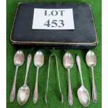 Six teaspoons plus sugar tongs in a case, Hallmarked Sheffield 1852, weighs 103g,