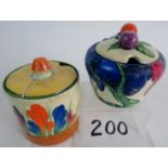 A Clarice Cliff Fantasque Bizarre preserve jar and cover in the Rudyard pattern (a/f - lid