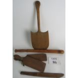 A selection of Treen items to include a truncheon marked Bank of England, a pair of butter paddles,