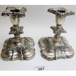 A pair of silver candlesticks, approximately 5" high, Birmingham 1900, slightly a/f.