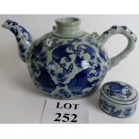 Blue and white ceramic Chinese teapot, decorated with fish, four character marks to base, 20cm high.