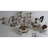 Silver plated teapot, sugar bowl, and cream jug, together with a pair of silver plated candlesticks.