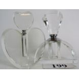 Two Art Deco style glass perfume bottles with screw-on lids, 19cm and 18cm high.