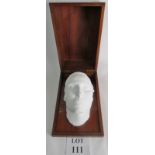 A Victorian death mask of a young lady mounted in a fitted wooden box, mask plaster of paris.
