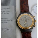 A swatch quartz wristwatch, 'Goldfinger', with a gold outer bezel,