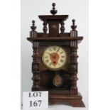 A continental architectural cased mantel clock, with key and pendulum, 46cm high.