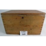 An early 20th century pine storage box with hinged lid and twin iron carrying handles.