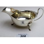 A silver sauce boat on pad feet, Sheffield 1934, approximately 3.5 troy oz/106 grams.