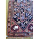 Belouch tribal rug, abstract zoomorphic motifs on a light tan ground, 187cm x 105cm approx.