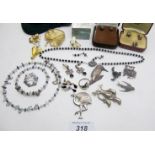 A collection of 6 silver bird and animal brooches, a 925 marked Dolphin ring, 4 pairs of earrings,