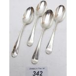 A set of four early Georgian silver teaspoons, decorated on the bowl with a basket of flowers,