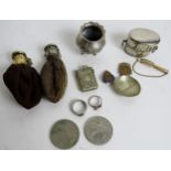 A collection of items to include 2 coins purses, 2 commemorative coins, silver stone set broach,