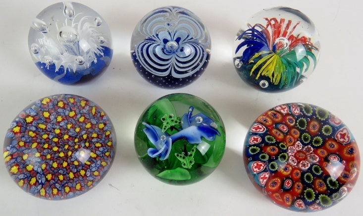 Six good decorative 20th century glass paperweights.