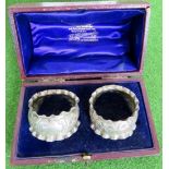 A pair of silver napkins rings, hallmarked Chester 1898, weight 33.4 grams.