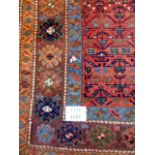 A late 19's/20's Persian rug, blue brown + red. 240cm x 124cm.