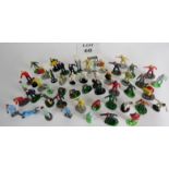 A collection of vintage figures, some pit crew, lane board holders etc.