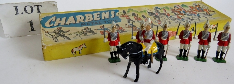 A box of Charbens metal toys, containing six guardsmen with swords drawn, plus a mounted officer,