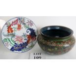 A vintage Chinese cloisonne bowl decorated with butterflies and flowers and a plate in the tobacco
