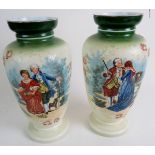 A pair of Victorian moulded glass vases decorated with scenes of courting couples.