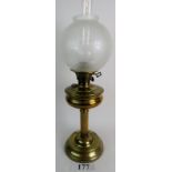 A late 19th /early 20th century brass oil lamp, with fluted column,