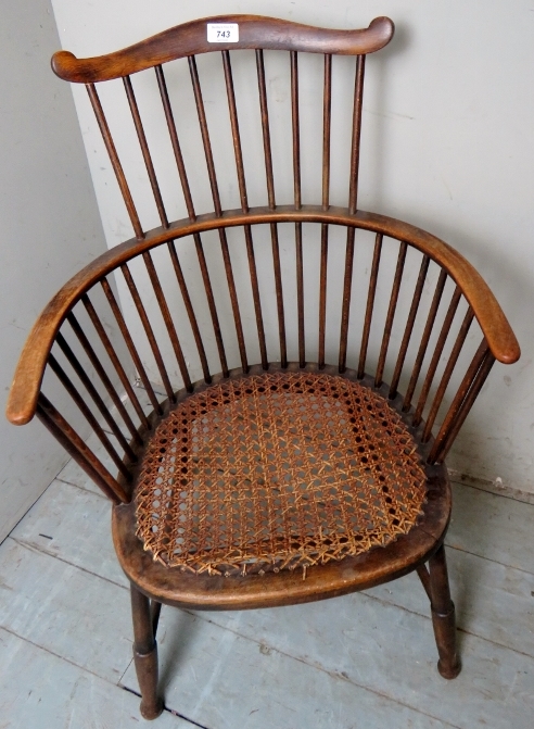 A 19th Century oak framed circular stick back elbow chair with bergere seat. - Image 4 of 4