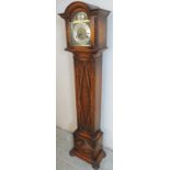 A 20th Century oak cased Westminster chiming grandmother clock with an arched dial having gilt