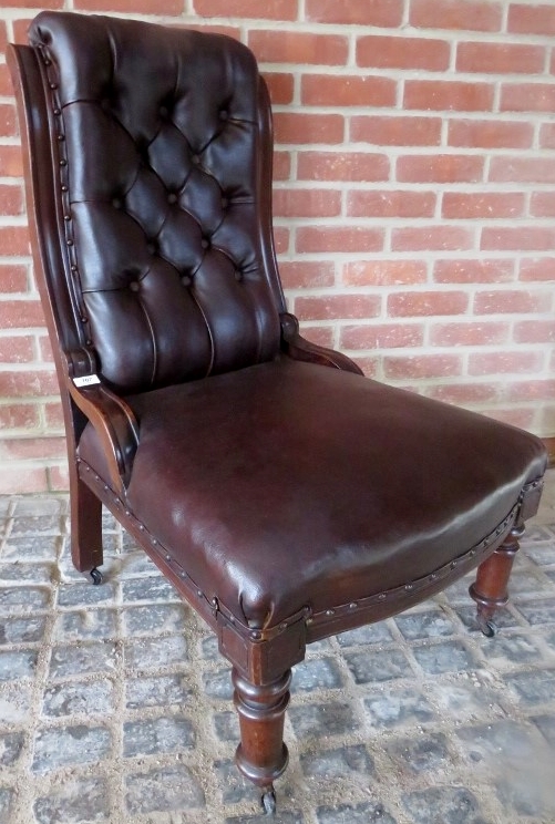 A Victorian mahogany framed library chair upholstered in button backed brown leather and - Image 5 of 5