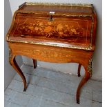 A 20th Century inlaid walnut ladies writing desk with a brass gallery rail over a fall front