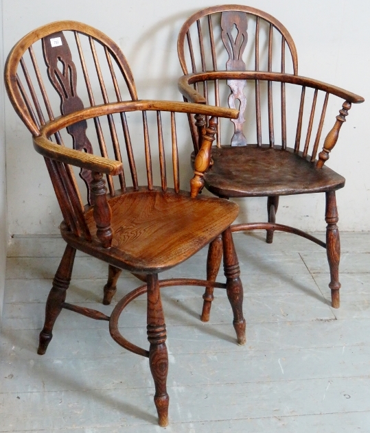 A pair of 19th Century oak framed country Windsor armchairs with turned upright supports and legs.