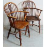 A pair of 19th Century oak framed country Windsor armchairs with turned upright supports and legs.