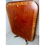 A large Regency mahogany and walnut crossbanded tilt top rectangular breakfast table with a turned