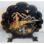 Oriental cloud chaped fire screen with landscape scene in gold and polychrome enamels on a black