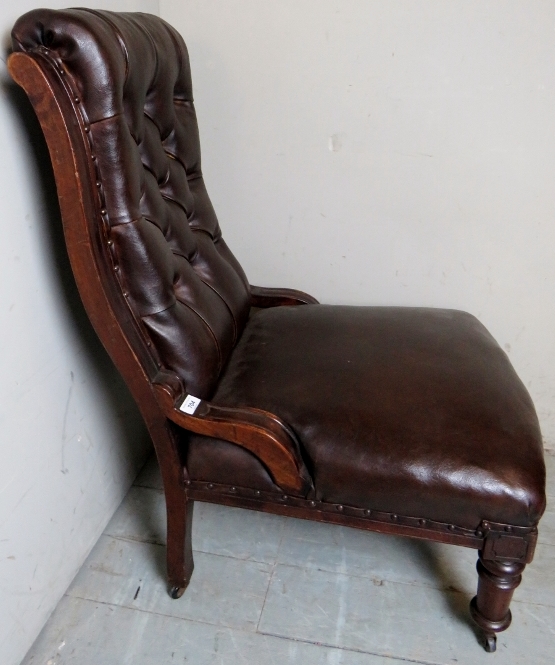 A Victorian mahogany framed library chair upholstered in button backed brown leather and - Image 2 of 5