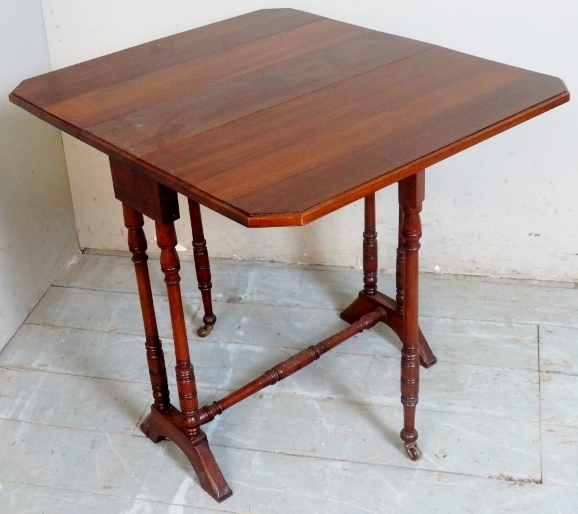 A small 19th Century mahogany drop leaf Sutherland table terminating on turned upright supports - Image 2 of 2