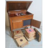 A C 1920's oak gramophone cabinet with a wind up record player, 'His Master's Voice, model 197',