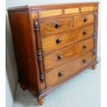 A large 19th Century mahogany chest of two short over three long drawers with bun handles and