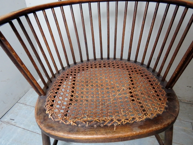 A 19th Century oak framed circular stick back elbow chair with bergere seat. - Image 3 of 4