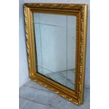 A contemporary gilt framed rectangular wall mirror with sectioned bevelled glass.