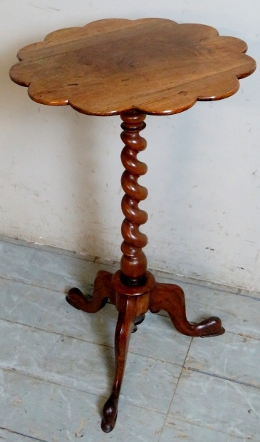 A 19th Century rosewood tripod wine table with corkscrew column and scalloped edge top over splayed