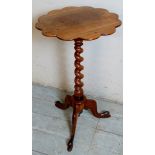 A 19th Century rosewood tripod wine table with corkscrew column and scalloped edge top over splayed