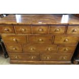 A 20th century pine bank of 13 assorted drawers, with turned handles, good solid construction,