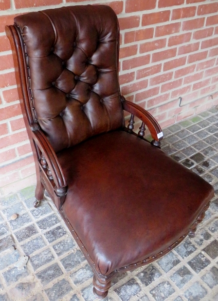 A Victorian mahogany framed armchair upholstered in brown button backed leather, - Image 4 of 4