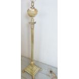 A large 19th Century adjustable brass standard lamp modelled as a corinthium column with a platform